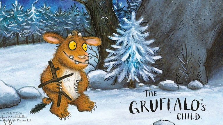 Illustration of Julia Donalsons The Gruffalo's Child. Wintry snowy forest scene with Gruffalos child carrying a stick man.